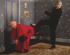 Kicking Bishop Brennan Up The Arse.jpg